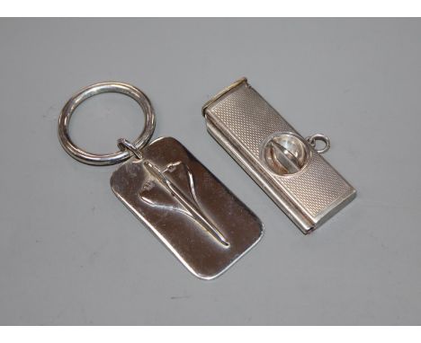 A modern silver concord key ring and a silver mounted cigar cutter.