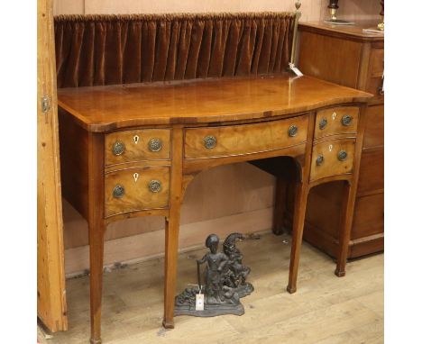 A George III style mahogany serpentine sideboard, W.136cm, D.62cm, H.93cmCONDITION: Overall in good condition with a nice col