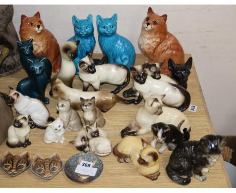 A collection of assorted pottery cats to include Beswick, Poole and WadeCONDITION: Nine of the pieces are Beswick