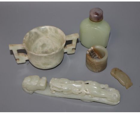 A Chinese jade belt hook, an archer's ring and figure, a stone cup and a glass snuff bottle