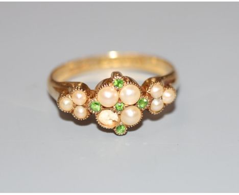 An Edwardian 18ct gold, split pearl and demantoid garnet cluster set dress ring, size P/Q, gross 3.9 grams.CONDITION: Tiny ch