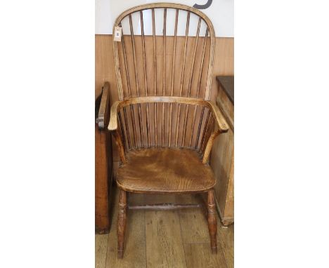 A 19th century ash and elm Windsor comb back armchairCONDITION: Faded appearance throughout, rear left leg chipped.