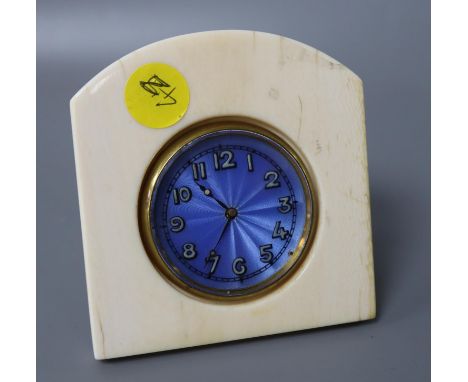 An ivory travelling clock with enamelled dial, height 9.5cm