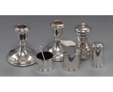 A pair of modern silver dwarf candlestick, Sheffield, 1994, 98mm, weighted, a modern silver pepper mill and a modern silver t