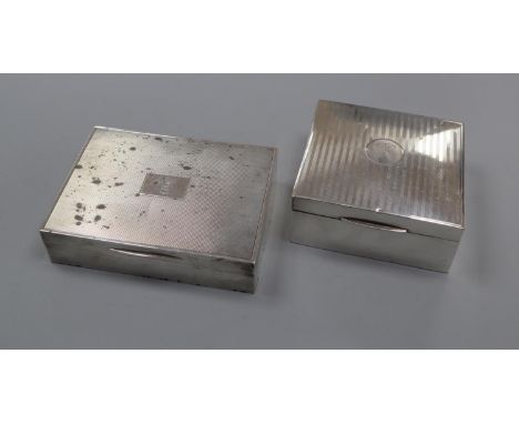 Two George V silver cigarette boxes, including engine turned by Mappin &amp; Webb, largest 12.8cm.CONDITION: Numerous tarnish