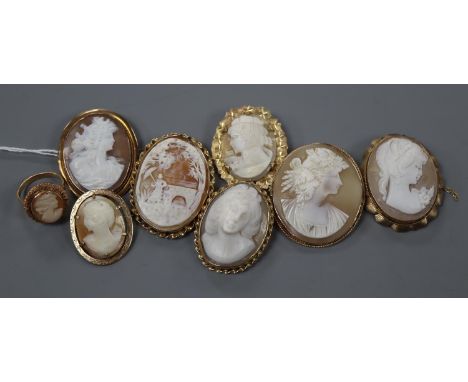 Seven assorted modern yellow metal mounted oval cameo shell brooches, five stamped 9ct and a yellow metal cameo ring.