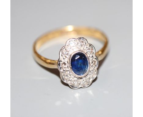 A modern 18ct gold and plat, sapphire and diamond oval cluster ring, size L, gross 2.6 grams.CONDITION: No visible damage to 