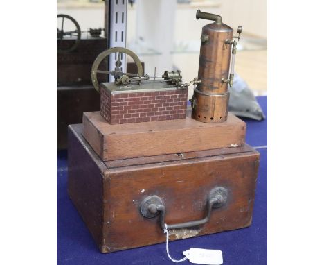 A fine Victorian scratch built model of a static steam engine, in brass and copper with a faux brick painted wood plinth, the