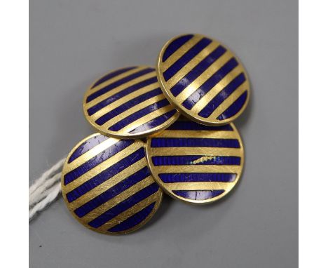 A pair of 18ct and enamel disc cufflinks, diameter 14mm, gross 8.3 grams.CONDITION: Nicks and scratches to the enamel in gene