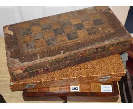 Three chess / backgammon boards and a few pieces