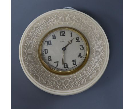 An eight day ivory travelling clock, diameter 11cm