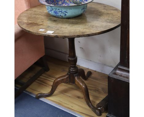 A George III oak and mahogany tilt top tripod tea table, diameter 76cm