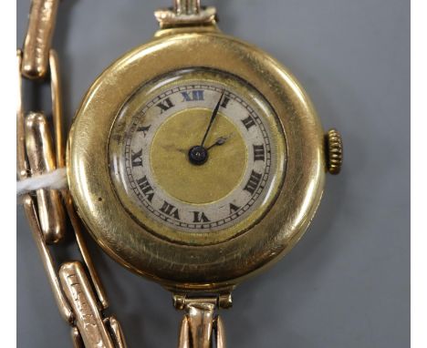 A lady's early 20th century 18ct gold manual wind wrist watch, on a 15ct flexible strap.CONDITION: A few dings on case back. 