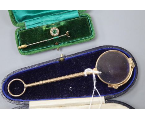 A pair of 14k gold plated lorgnettes, 14.2cm and a paste set stick pin (a.f.).