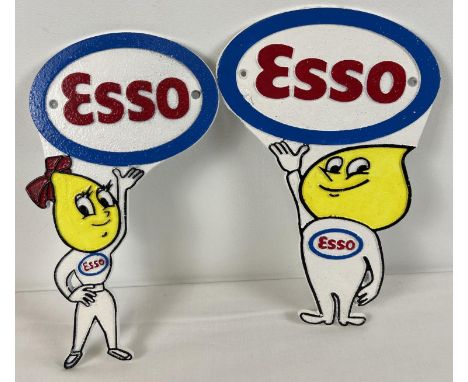 A pair of Esso painted cast iron wall plaques depicting the oil drop boy and girl mascots. With holes for fixing. Approx. 29c