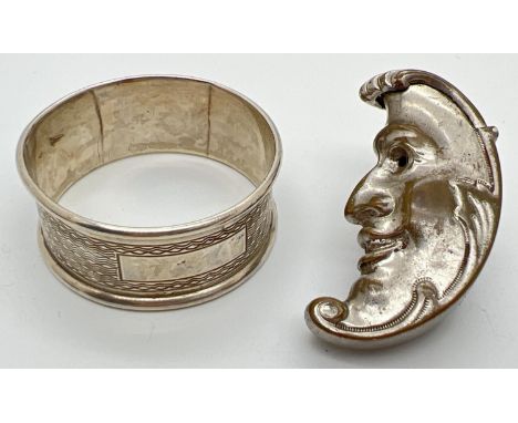 A novelty silver plated vesta case together with a silver napkin ring. Crescent moon shaped vesta, with smiling face detail, 