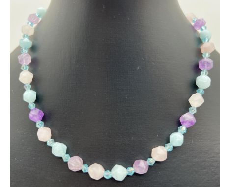 An aquamarine, amethyst and rose quartz 16" beaded necklace with T bar clasp. Made from from alternating faceted 8mm beads. R