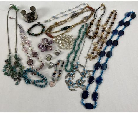 A collection of assorted vintage and modern costume jewellery to include natural stone items. Lot includes beaded necklaces, 