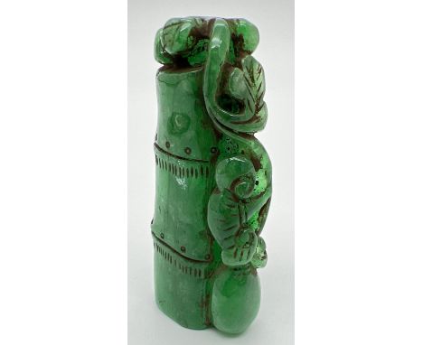 A carved piece of jade in the form of bamboo with foliate detail. Approx. 6.5cm long. 