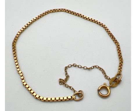 A 9ct gold box chain 7.5 inch bracelet with spring style clasp (needs attention). Total weight approx. 2.6g. With safety chai