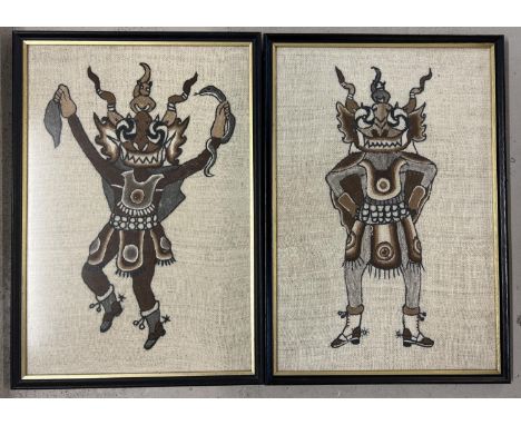 2 framed and glazed tapestry wool panels depicting tribal figures. Frame size approx. 55cm x 38cm. 