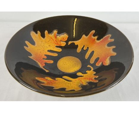 A large Poole Pottery 'Aegean' ceramic bowl in autumnal colours with oak leaf design. Approx. 34cm diameter x 9cm tall. Stamp