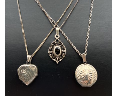 3 silver necklaces. A vintage circular locket with sun-ray detail to front, a heart shaped locket with engraved floral detail
