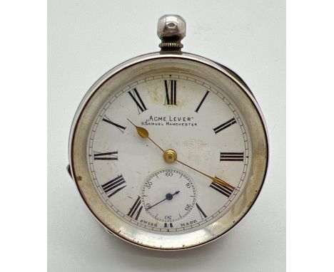 A vintage silver pocket watch by "Acme Lever" H. Samuel, Manchester. Enamel face with gold tone hands and secondary dial. Sil