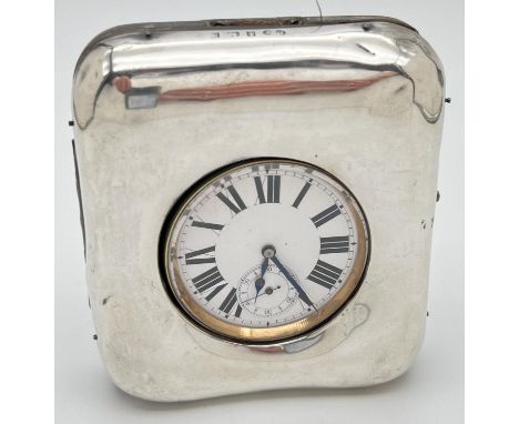 A late Victorian silver covered pocket watch stand with an Argentan Goliath pocket watch. Silver fronted brown leather stand 