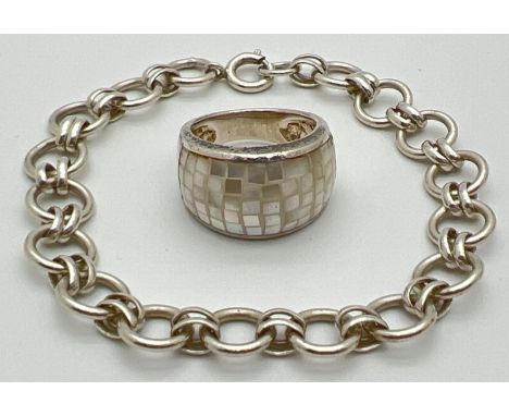 2 silver jewellery items. An alternating oval and round cut link bracelet with spring clasp and a band style ring set with sm