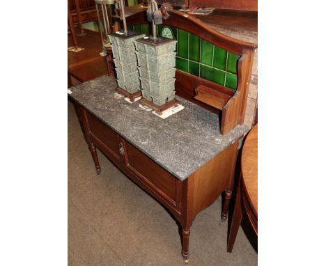 A late Victorian washstand with green tile back and grey marble top 