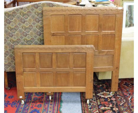 Mouseman: a Robert Thompson of Kilburn panelled English oak 3ft single bedstead, the headboard and footboard with penny mould