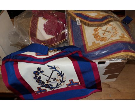 A collection of Masonic regalia including nine aprons, two collars and jewels, a sash, two further collars; and a collar jewe
