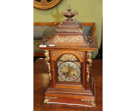 A walnut quarter striking mantel clock