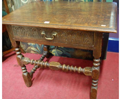 A circa 1900 joined oak single drawer side table, in the 17th century style, raised on bobbin turned and square cut support u