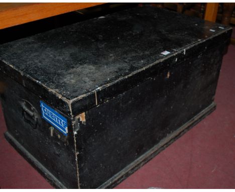 A late 19th century black painted pine hinge-top tool chest, with iron end carry handles and some sundry contents 