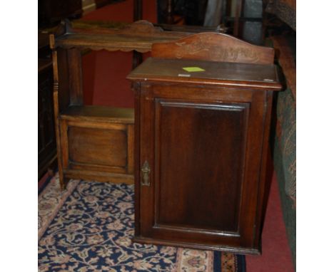 An Edwardian mahogany single door wall cupboard; together with an oak double door wall cupboard with upper shelf (2)