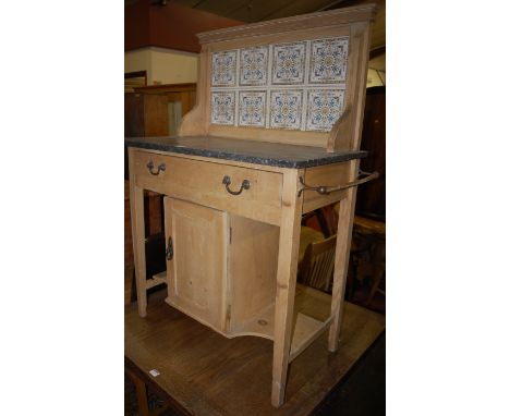 An Edwardian pine black marble topped and tile inset single drawer washstand, having central cupboard door, w.78cm 