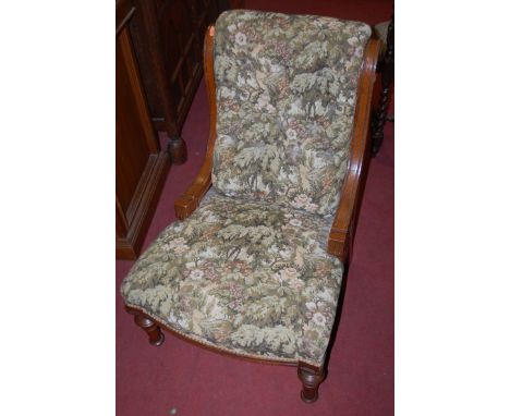 A Victorian oak and floral button back upholstered nursing chair, together with a wingback armchair (2)
