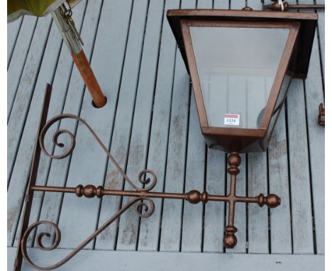 A Victorian style painted wrought iron garden wall light, together with various brackets