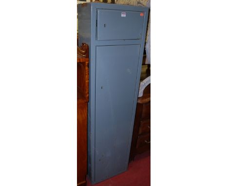 A mid 20th century enamelled metal freestanding two door gun cabinet, with keys, width 41cm