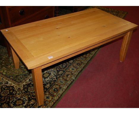 A contemporary light oak rectangular low coffee table, length 120cm 