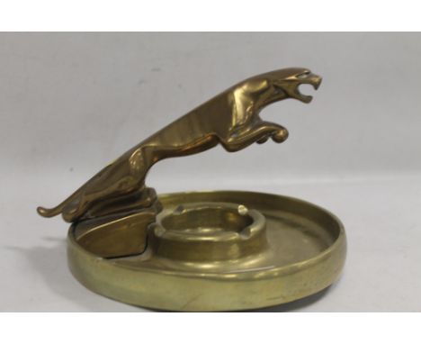 A HEAVY BRASS ASHTRAY WITH JAGUAR MASCOT FINIAL 