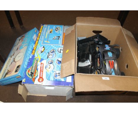 FOUR VARIOUS REMOTE CONTROL VEHICLES WITH HAND SETS, to include a boxed radio control air super hogs helicopter and a boxed S