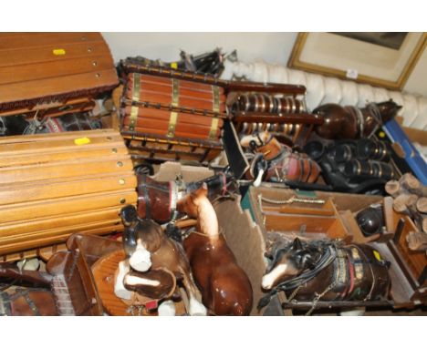 A LARGE QUANTITY OF ASSORTED CERAMIC HORSE AND CART FIGURES