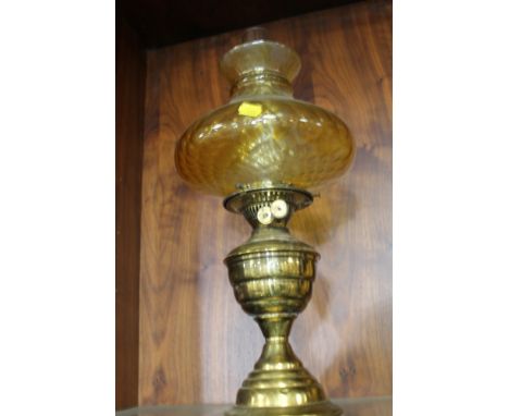 A VINTAGE BRASS OIL LAMP WITH GLASS SHADE 