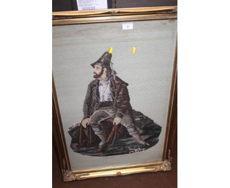 A FRAMED AND GLAZED TAPESTRY