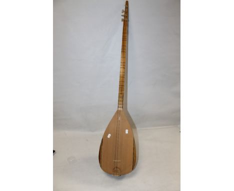 AN UNUSUAL WOODEN TURKISH STRING INSTRUMENT 'SEMSI YASTIMAN SAZ EVI ISTANBUL' 