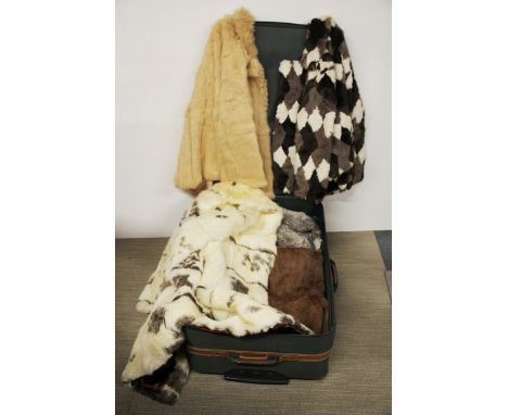 A case of vintage fur coats.