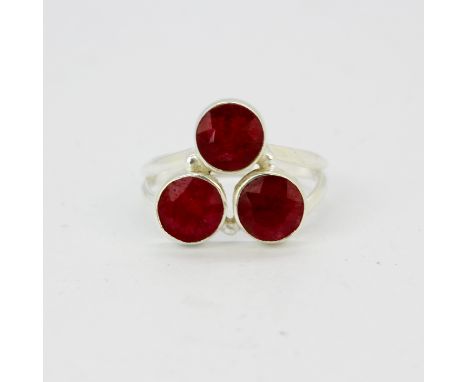 A 925 silver ring set with three rubies, (O).